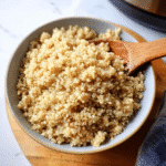 How to Make Perfect Instant Pot Quinoa Every Time 6 Fluffy instant pot quinoa in bowl with wooden spoon