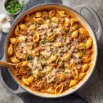 creamy shells and beef dinner served in a rustic bowl