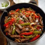One Pan Pepper Steak Recipe for Quick and Easy Dinners 7 one pan pepper steak in a skillet with sauce