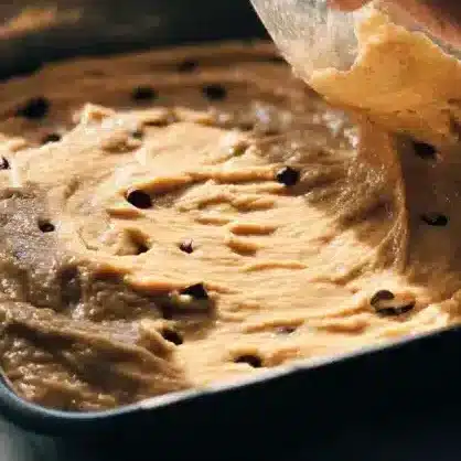 Sheet Pan Cookie Cake (for Kids Birthday Parties) 7 Sheet Pan Cookie Cake batter being spread in a pan